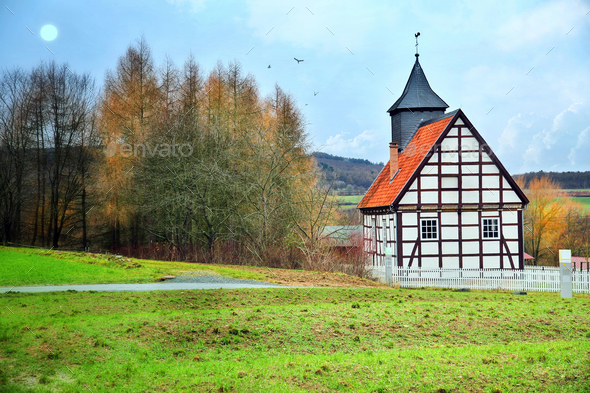 Vintage Old German Farm House and Nature Stock Photo by okanakdeniz